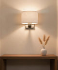 Edwarmlux Indoor Wall Sconces, Brushed Nickel, 1 Pack, E26 Bulbs Excluded on a wall illuminating a hallway with soft light.