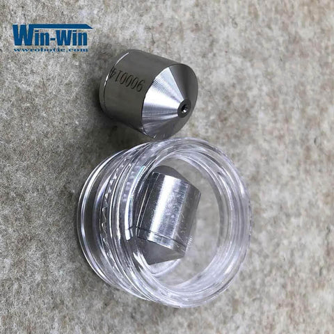 Front view of two-piece Allfi waterjet valve seat: metal conical poppet seat and clear cap.