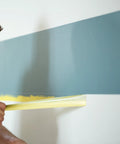 Person applying Delicate Surface Painters Tape With PaintBlock Technology For Clean Lines On Fresh Paint Pro Grade DIY Friendly 1.5 Inch