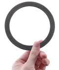 Hand holding Two Pack Foam Gray Sink Strainer Gasket Seal Ring For Three And A Half Inch Kitchen Basket Drain Stops Leaks No Plumber Putty Needed Easy Install No Fuss Leak Proof Kitchen Repair