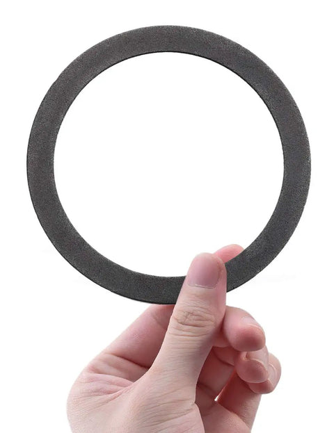 Hand holding Two Pack Foam Gray Sink Strainer Gasket Seal Ring For Three And A Half Inch Kitchen Basket Drain Stops Leaks No Plumber Putty Needed Easy Install No Fuss Leak Proof Kitchen Repair