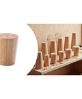 Solid As A Rock Adjustable Furniture Levelers For Couches Tables And Chairs Made From Rich Oak Wood with various shapes on a workbench.