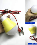 5V 5W yellow and white LED bulb with wires and clamps, demonstration of DIY Wind Turbine Kit For Teaching And Science Projects, Hands-On Tiny DC Motor Generator, Micro Wind Turbine With Fan Blades And LED Light, Power Generation Demo For Classrooms And Makerspaces.
