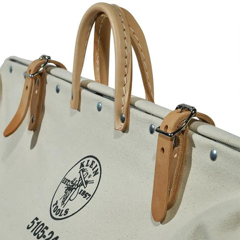 Top view of Pro Grade Heavy Duty Canvas Tool Bag With Moisture Resistant Vinyl Bottom And Steel Frame For Rugged Use, 24 Inch, Durable Storage Organizer For Pros And DIYers Everyday, showing leather handles and fastenings.