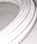 Close-up of white coil from Lined Bicycle Derailleur Cable Housing Kit With 4mm Inner Wire, 50 Ft Roll, 50 End Caps, Compatible With SRAM And Shimano Mountain And Road Bikes, DIY Install, Durable Taiwan Made, Great For Quick Gear Fixes