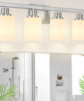 4-Light Nickel Modern Bathroom Vanity Light Fixture With Milky White Glass Shades installed above mirror