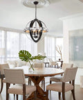 Styled dining room with Boss Look Black Aspen Wrought Iron Globe Wood Four Light Chandelier, 20 inch shade, 22.5 inch height.