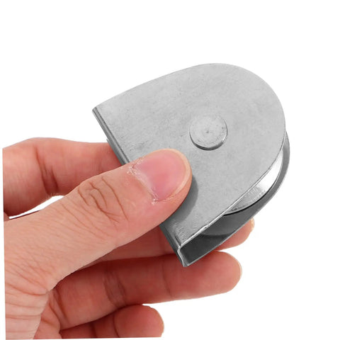 Badass 4 Piece Stainless Steel Flagpole Pulley Kit Featuring Smooth Bearing Wheels For Effortless Flag Raising Any Day And Built Tough Enough To Handle Rain Or Shine Because You Want Hardware That Lasts Long Without Rusting On Your Outdoor Pole. close-up of stainless steel pulley wheel in hand