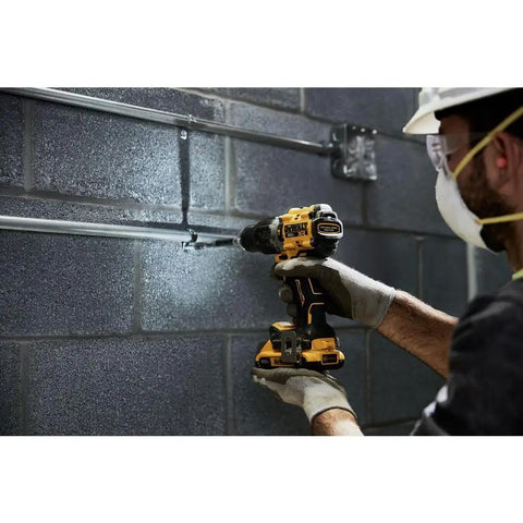 Worker using Compact 1/2 Inch Cordless Hammer Drill With Brushless Motor 2 Speed Settings Bare Tool on concrete wall