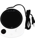 This Solid Electric Mug Warmer Boasts Four Heat Presets To Keep Your Daily Brew Piping Hot All Day Long Featuring Smart Auto Shut Off Protection And Fast Heating With A Sleek White Top For Desk Setup, shown from the top with a black heating surface and cord.