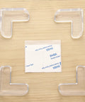 Safe Corner Protectors For Furniture With Double Sided Adhesive Tape 30 Pack PVC Corner Bumpers layout on wooden surface