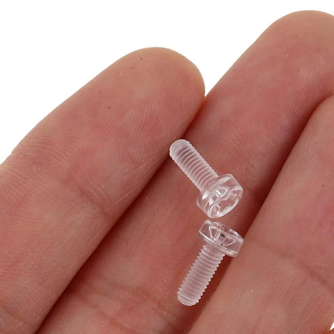Close-up of acrylic screws from 100 Pieces Acrylic Triangle Corner Fasteners Kit With M3x6 Round Head Screws And M3x2.4 Hex Nuts For Three Sided Fixation Tight Grip Heavy Duty DIY Home Improvement Furniture Repair Cabinet Assembly And Mechanical Installations.