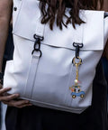 Cute Golf Keychain For Women Sporty Bag Charm Gold Plated Purse Charm For Handbags Backpacks And Bags Trendy Accessory For Everyday Carry Gift Great Gift For Her on a white backpack.