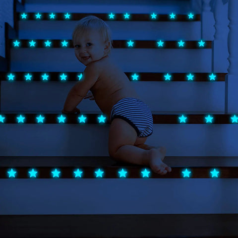 Baby on stairs with Night Sky Glow Stars Ceiling Stickers Kit With 1049 Pieces Including Moon And Stars, Self Adhesive Wall Decals