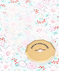 Transparent cover with circular cardboard backing featuring AUTOTOOLHOME, set against a floral patterned background.