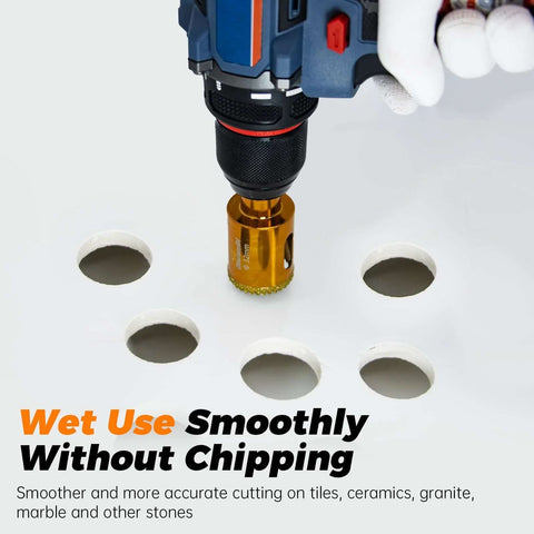 Front view of blue cordless drill with 1-1/4in gold diamond hole saw drilling ceramic tile.