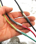 Get This Heavy Duty Underground Wire Splice Kit For Submersible Pumps Featuring Clear Dual Wall Heat Shrink And Black Outer Sleeve To Seal 16-14 Awg Four Conductor Cords Waterproof And Repair Electrical Connections With Ease. four-conductor cable splice with heat shrink on 16-14 AWG wires