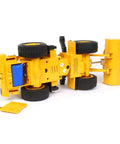 Underside view of 1/24 Scale Caterpillar 950M Wheel Loader RC Toy With Realistic Lights And Sound showing wheels and mechanics.