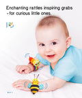Kickass Infant Sensory Play Kit Featuring Ultra Bright Wrist Rattles And Comfy Foot Finder Socks Crafted For Teething Toddlers Ages 0 To 12 Months Is The Ultimate Milestone Gift: baby boy smiling with colorful wrist rattle toys.