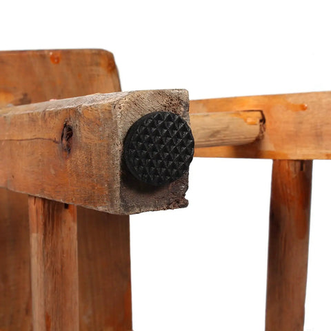 Close-up of chair leg with rubber pad from 48 Pack Self Adhesive Rubber Pads For Furniture Tables Chairs And Appliances Durable Floor Protectors