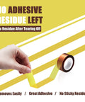 Four Rolls Of 20mm By 16m Heat Transfer Tape For High Temperature Sublimation And Vinyl Press No Residue Easy Peel Polyimide Film Tape With High Temp Adhesive For Clean Precise Sublimation Application being peeled off by hand showing no residue.