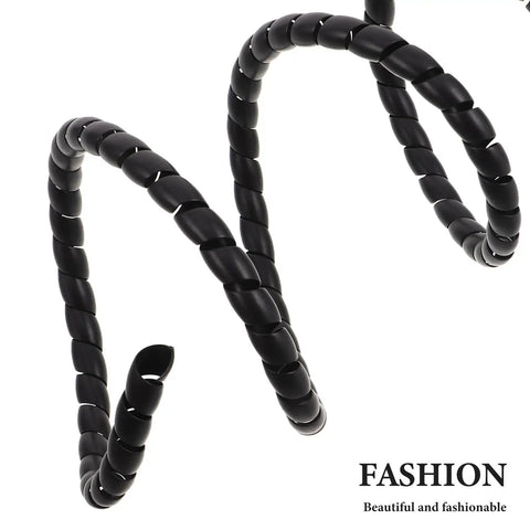 Black twisted cable protection spiral close-up with 'FASHION' branding. Image does not match Electric Scooter Side Cover Replacement Parts focus.
