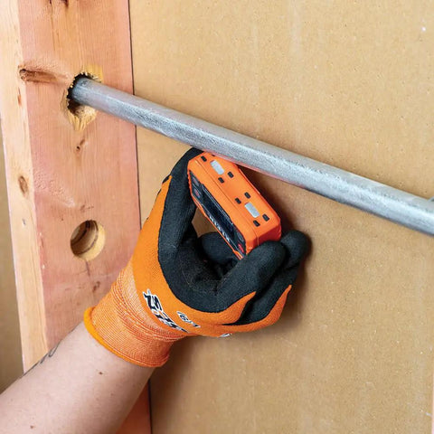 Digital Level And Angle Gauge With LED Alert And Angle Setter used on metal pipe by gloved hand