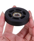 Universal Luggage Wheel Replacement Kit With Quiet Roll, Four Swivel Wheels, Easy Install For Travel Bags And Suitcases, Smooth 360 Degree Rotation, Durable Plastic Build For Everyday Travel, black plastic wheel close-up in hand