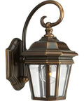 Oil rubbed bronze One-Light Wall Lantern with clear beveled glass and scroll arm details for outdoor use