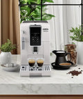 Slick One Touch Bean To Cup Espresso Maker In Crisp White featuring steel burr grinder, brewing espresso shots on countertop.