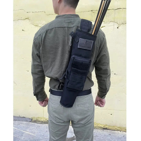 Person wearing the Lightweight Back Archery Quiver With Dual Use Foldable Hip Bag, black, holding arrows.