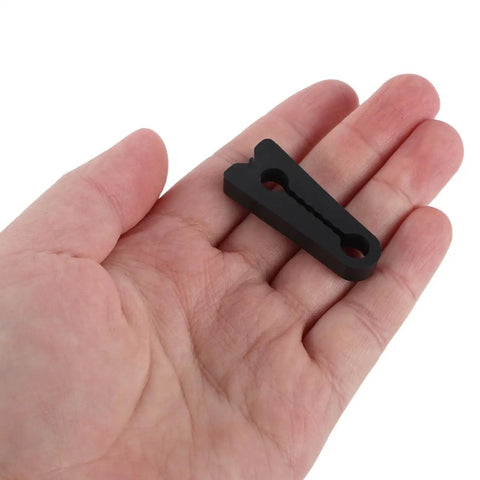 40Pcs Universal Fit Car Door Shock Absorber Pads Rubber Buffer Damper Deadener For Noise Reduction And Super Quiet Latch Guard Cushion To Kill Those Bangs in a hand, showcasing the black rubber pad.