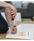 Installing Rock Solid Adjustable Hinges For Doors And Folding Tables with a screwdriver on a white panel.