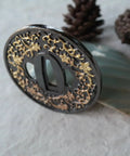 Koshirae Style Samurai Sword With Alloy Tsuba 100 Black And Gold Morning Glory Pattern close-up of tsuba detail on display