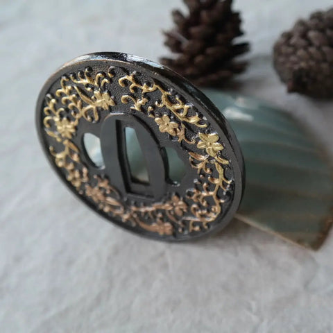 Koshirae Style Samurai Sword With Alloy Tsuba 100 Black And Gold Morning Glory Pattern close-up of tsuba detail on display