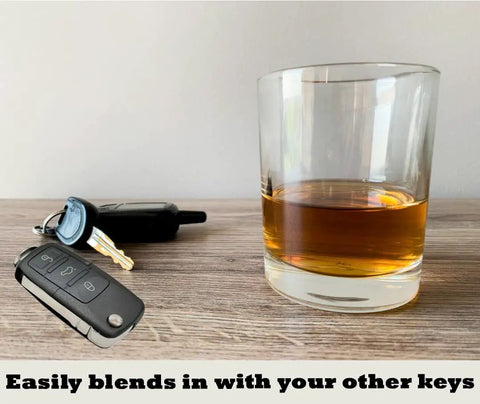 Lowkey Discreet Car Key Diversion Safe with Hidden Secret Compartment Stash Box next to glass, showing keychain size and blend