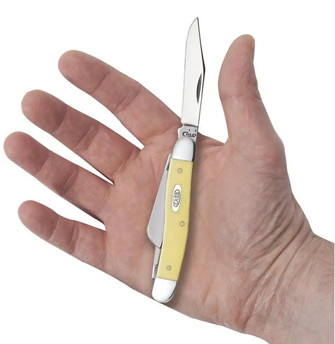 Dang Tough Yellow Synthetic Handle Stockman Pocket Knife With Clip Spey And Sheepfoot Chrome Vanadium Steel Blades held in hand.