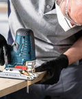 Person using a jigsaw with Pro Gear Tear Free Jigsaw Blades T Shank T 308 Bo on wood for smooth cuts.