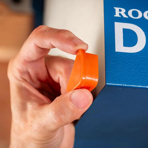 Person holding an orange component next to the Compact Ceiling Air Filtration Unit With Heavy Duty Triple Stage Filters.