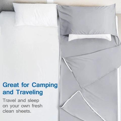 Ultra Soft Microfiber Sleeping Bag Liner With Heavy Duty Two Way Zipper For Hotels And Hostels, folded on bed, gray