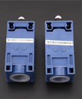 Elevator Speed Limiter Buffer Tension Wheel Switch With Manual Reset And Automatic Reset, two blue components on a black background