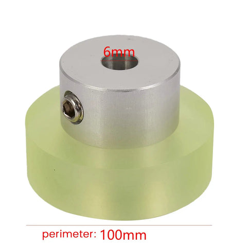 Close-up of 100mm Aluminum Polyurethane Encoder Wheel for Rotary Encoders Pro Grade Workhorse Industrial Measuring Wheel, green and silver