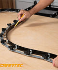 Using Heavy Duty Flexible Curve Template Kit With 107 And 37 Inch Steel Contour Guides for precise markings on wood surface.