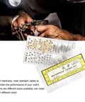 Gold And Silver Watch Stem Extender And Repair Kit With Stainless Steel Parts in case, used by a watchmaker.