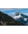 Game Changing 86 Inch 4K Ultra HD Commercial Digital Signage Display showing scenic mountain view with blue sky and clouds.