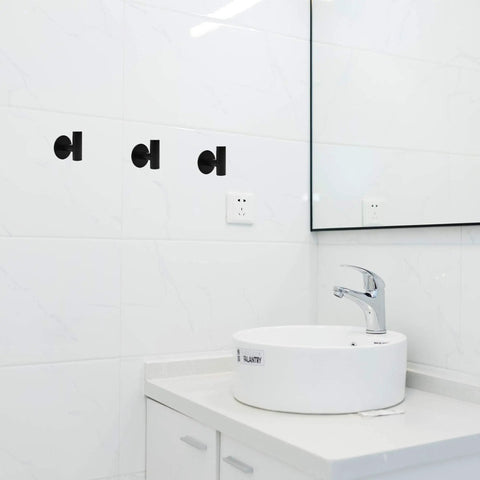 Three Pack Self Adhesive Stainless Steel Towel Hooks Black Matte Heavy Duty Wall Mounts For Bathroom Kitchen Bedroom Waterproof Holds Up To 3kg No Drilling Required installed on bathroom tiles.
