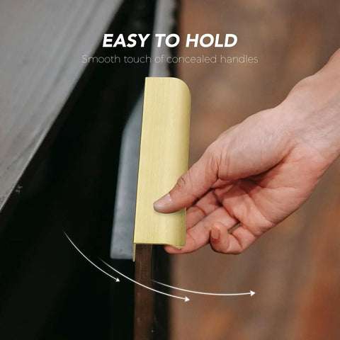 Hand holding a gold finger edge cabinet pull from the 15 Pack Gold Finger Edge Cabinet Pulls With 256mm Hole Center 10 Inch And 300mm Length 11.81 Inch Zinc Alloy Concealed Drawer Handles For Kitchen Cabinets And Drawers set.