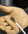 Gloved hand holding Universal BNC Compression Coax Connector For RG6 And RG6 Quad Shield Cables Male 10 Pack in installation setting