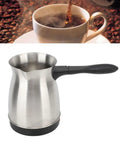 600W Stainless Steel Turkish Coffee Maker Kettle With Ergonomic Handle All In One Electric Tea And Milk Heater, Even Heating, 110V US Plug, 600ML Capacity, Durable Kitchen Pot shown next to a cup of coffee.