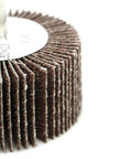 Close-up of Aluminum Oxide Flap Wheel Set Two Inch By One Inch With Quarter Inch Shank Mounted 80 Grit for polishing